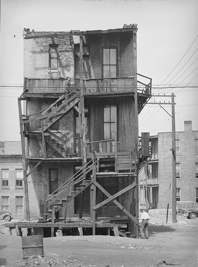 Rear wooden porches and stairs of multi-family dwellings rented to Black families on the South Side of Chicago in 1941.